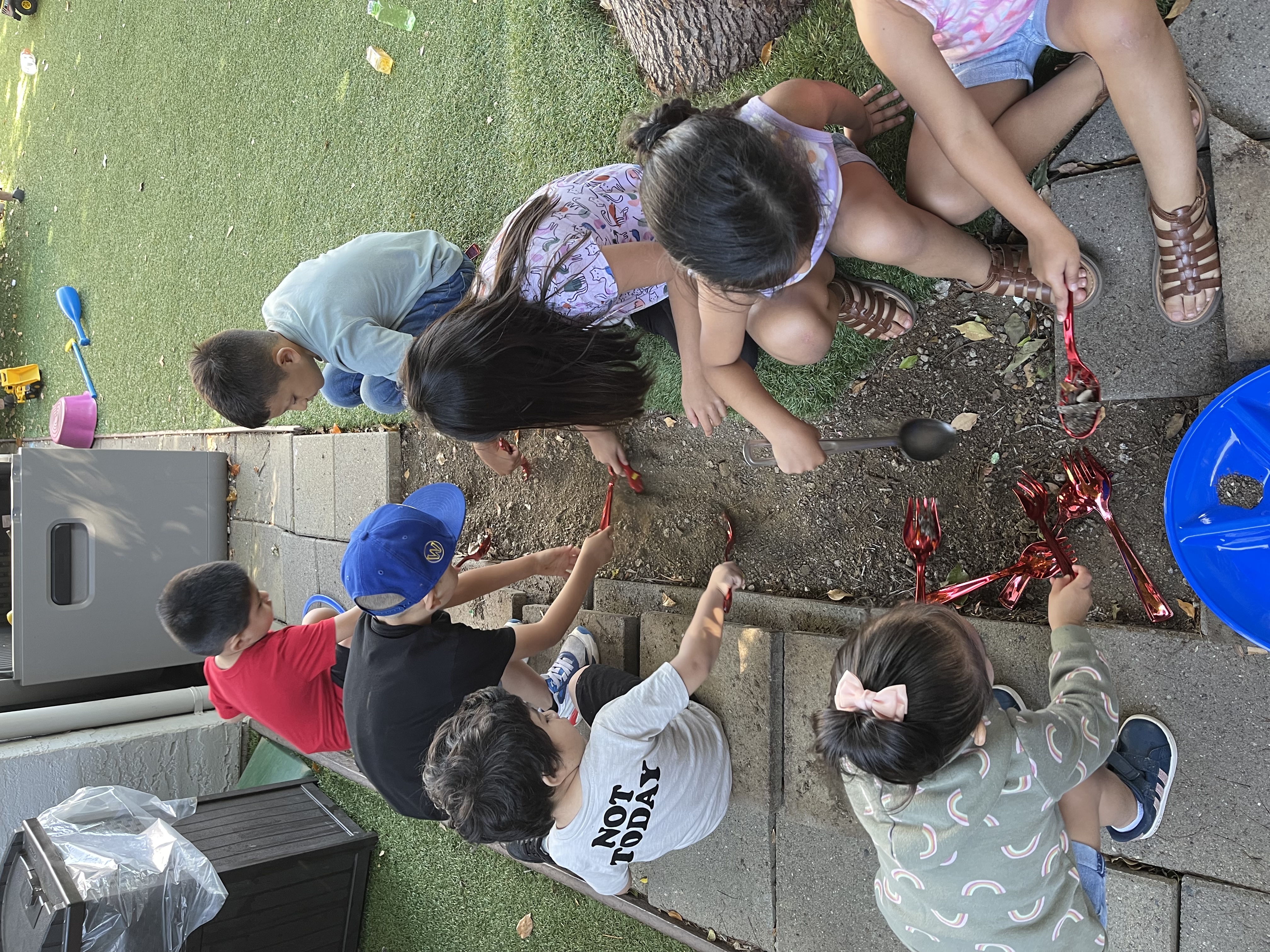 Children having outdoor picnic lunch